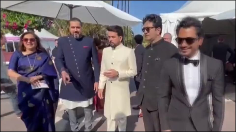 Deepika Padukone wearing a black and golden sari on the red carpet of Cannes Film Festival 2022