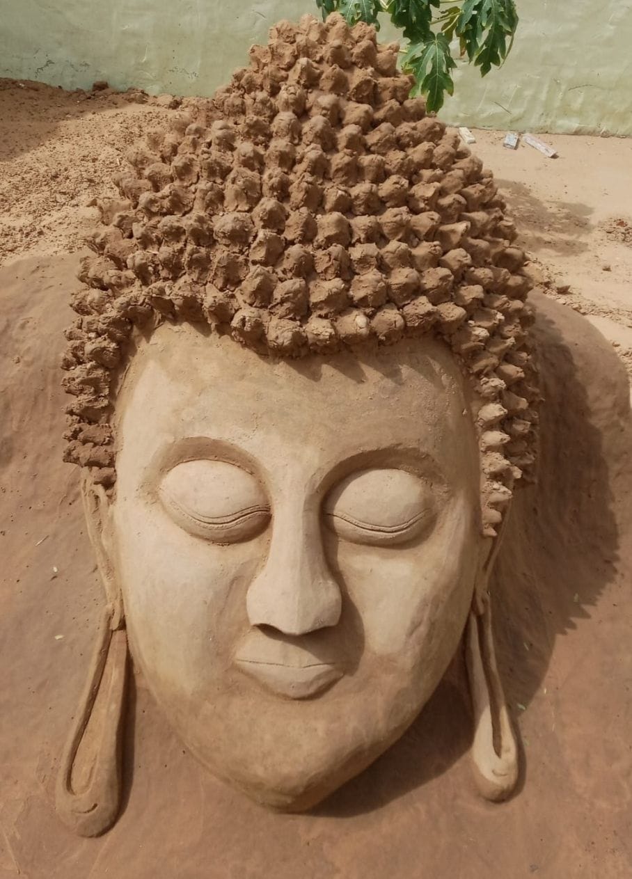 Beautiful artwork of Mahatma Buddha made on sand sand