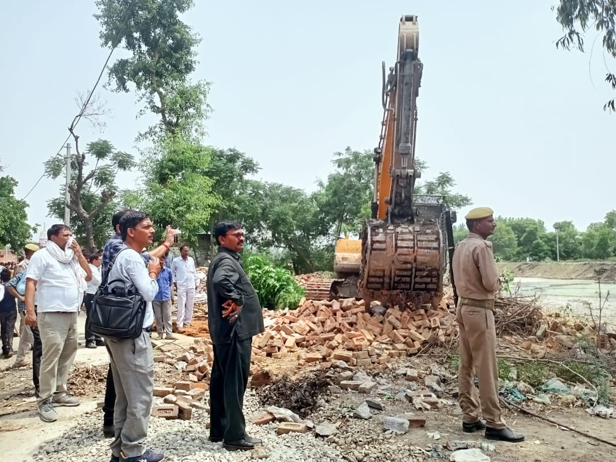 Bulldozer on the encroachment of the pond