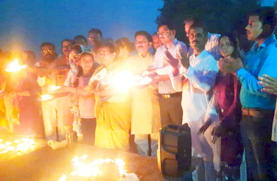 Aarti by lighting a lamp at the Ghat of the river Khannaut