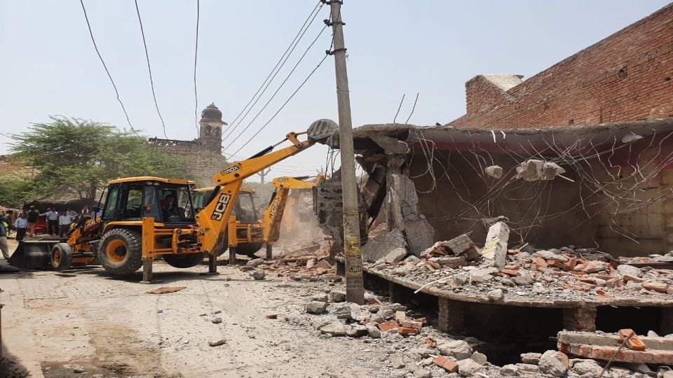 SP leader Ramnath Singh shops demolished by bulldozer in Etah