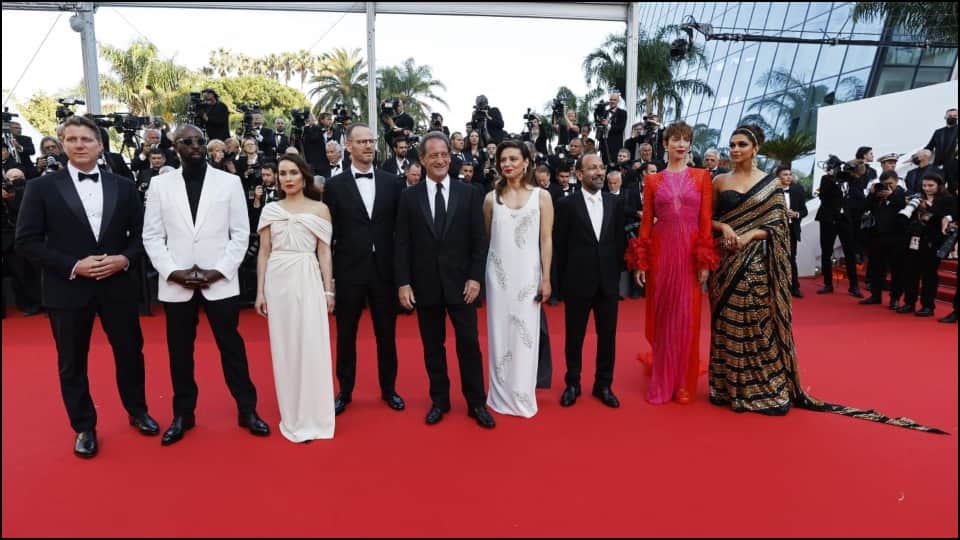 Deepika Padukone wearing a black and golden sari on the red carpet of Cannes Film Festival 2022