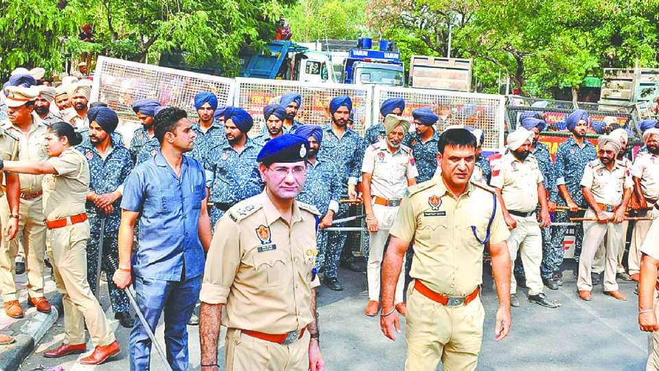 Farmers sit on a protest at Chandigarh Mohali border against Punjab government