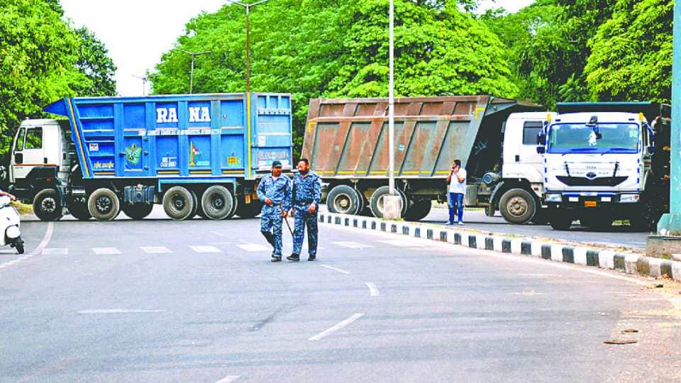 Farmers sit on a protest at Chandigarh Mohali border against Punjab government