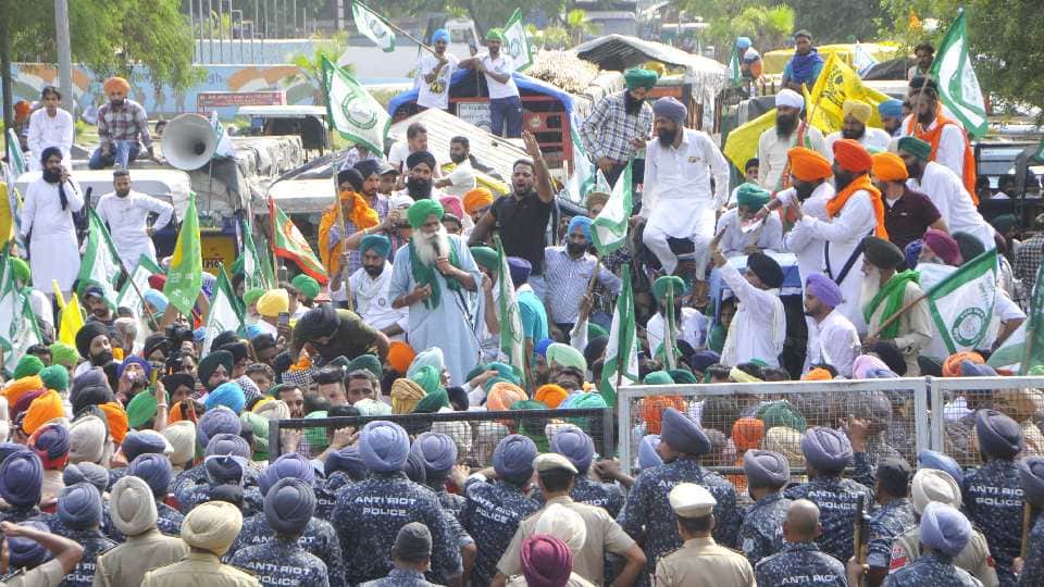 Farmers sit on a protest at Chandigarh Mohali border against Punjab government