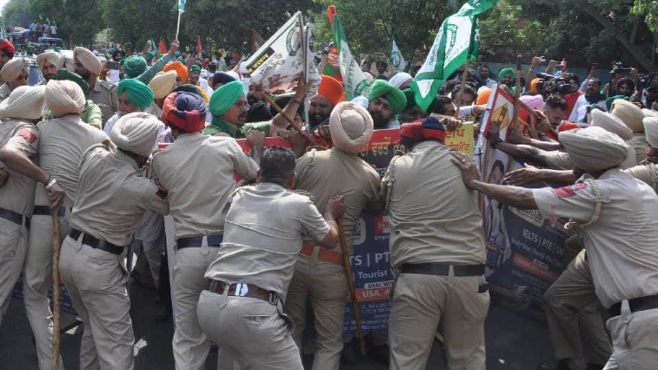 Farmers sit on a protest at Chandigarh Mohali border against Punjab government