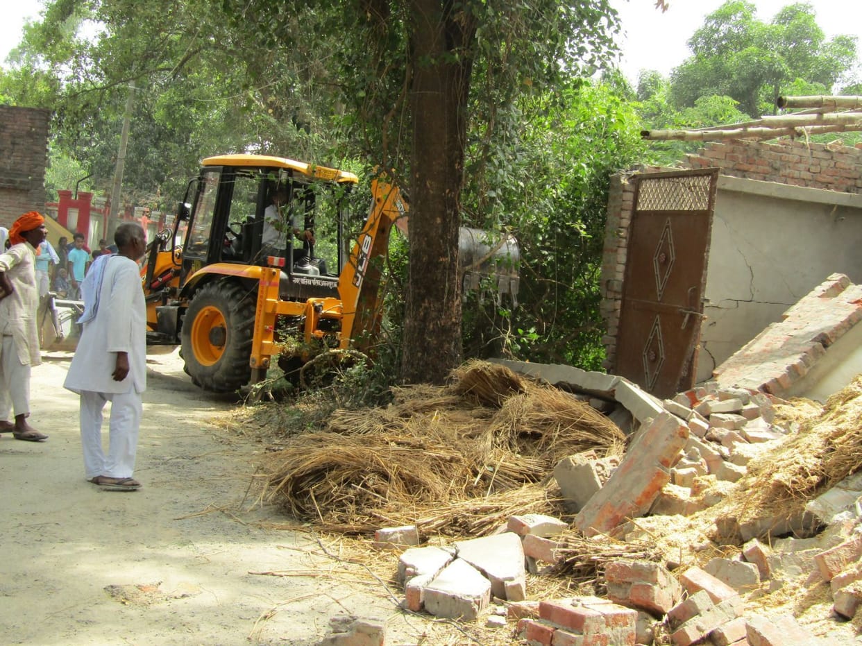 Bulldozer run on illegal construction on civil aviation land