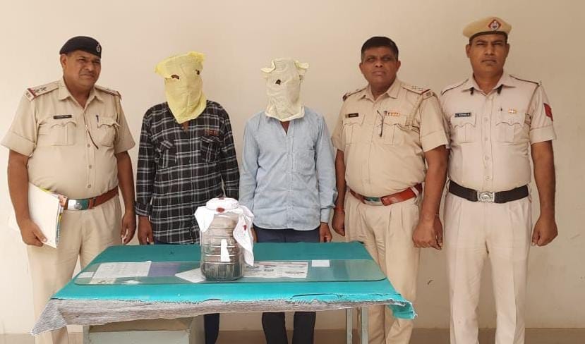 One kg 540 grams of opium recovered from two persons in car