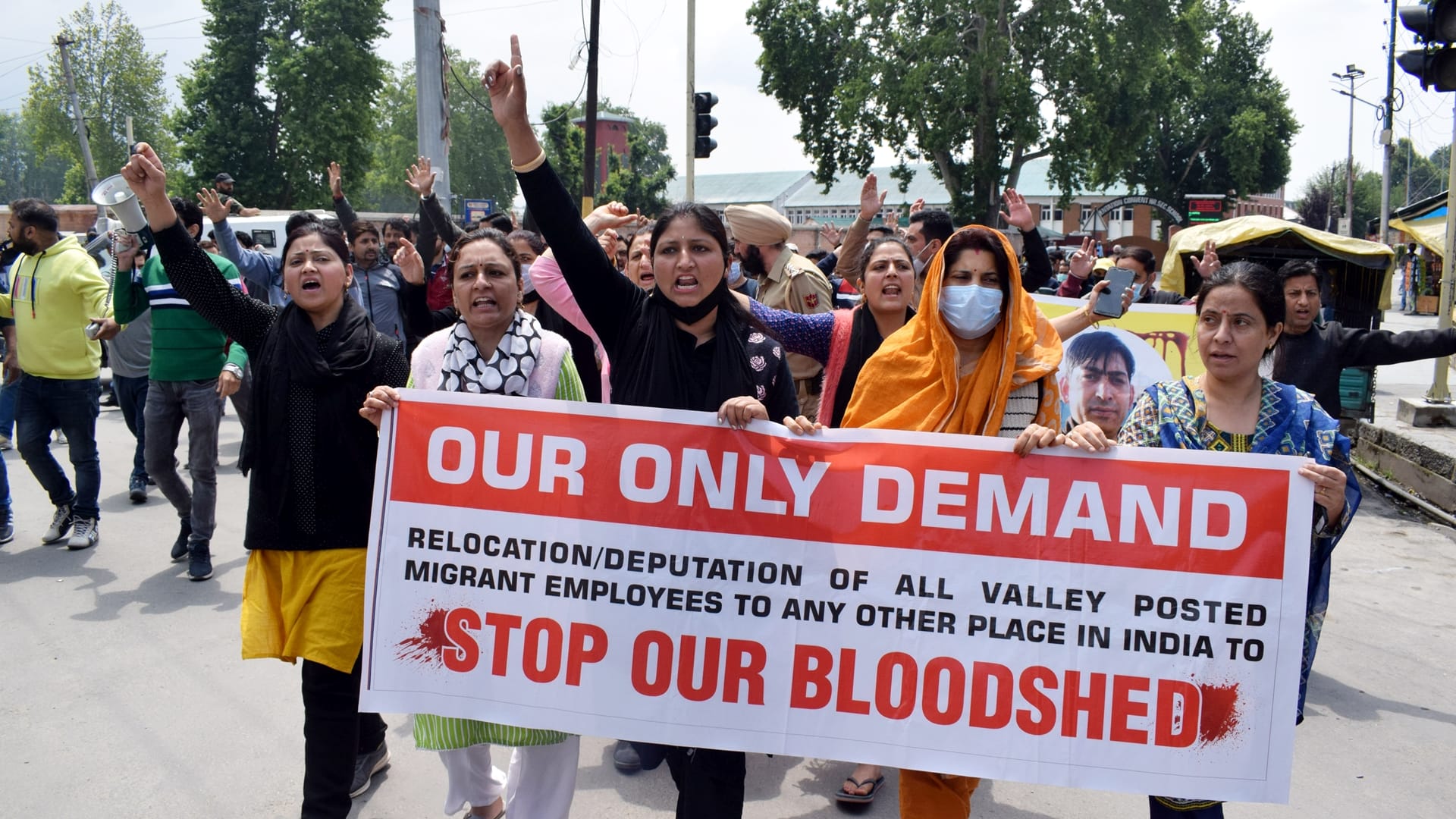 Rahul Bhatt 10th Day Kashmiri Pandits protest continues in kashmir organize rally pay tribute to Rahul by immersing flowers in Jhelum river