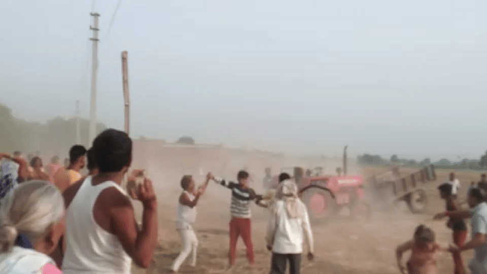 Tractor running to crush the crowd people raining stones agra