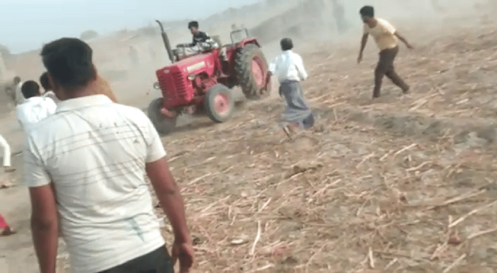Tractor running to crush the crowd people raining stones agra