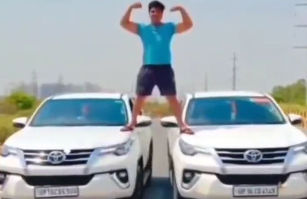 Dangerous stunts by climbing cars in film style