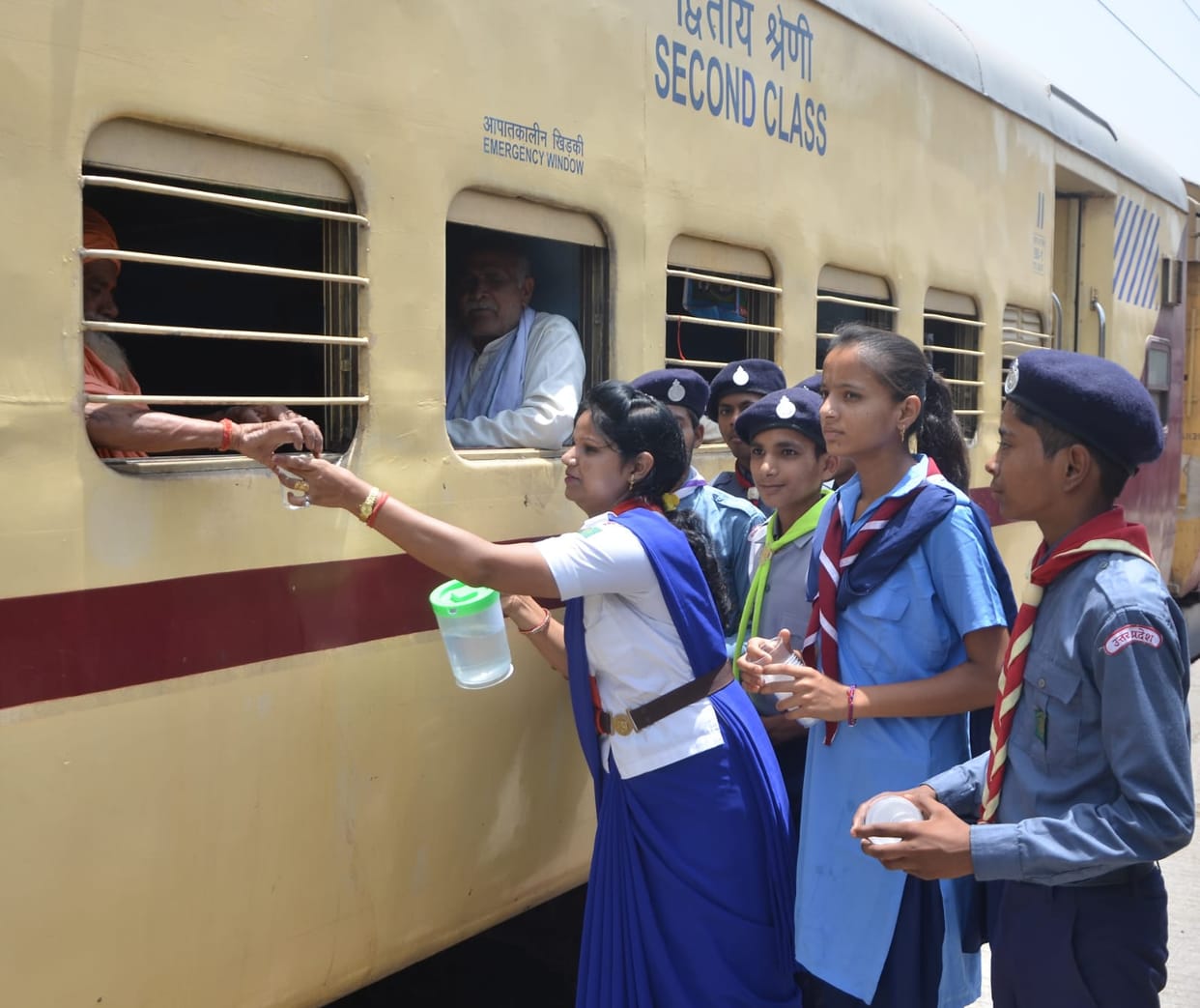 Scout guide gave water to passengers at railway station