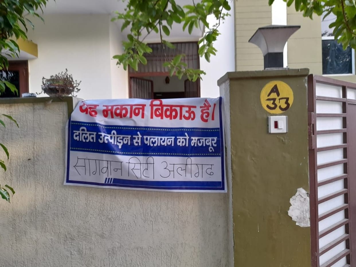 Scheduled caste people hang the banner of 'House for sale' on the houses