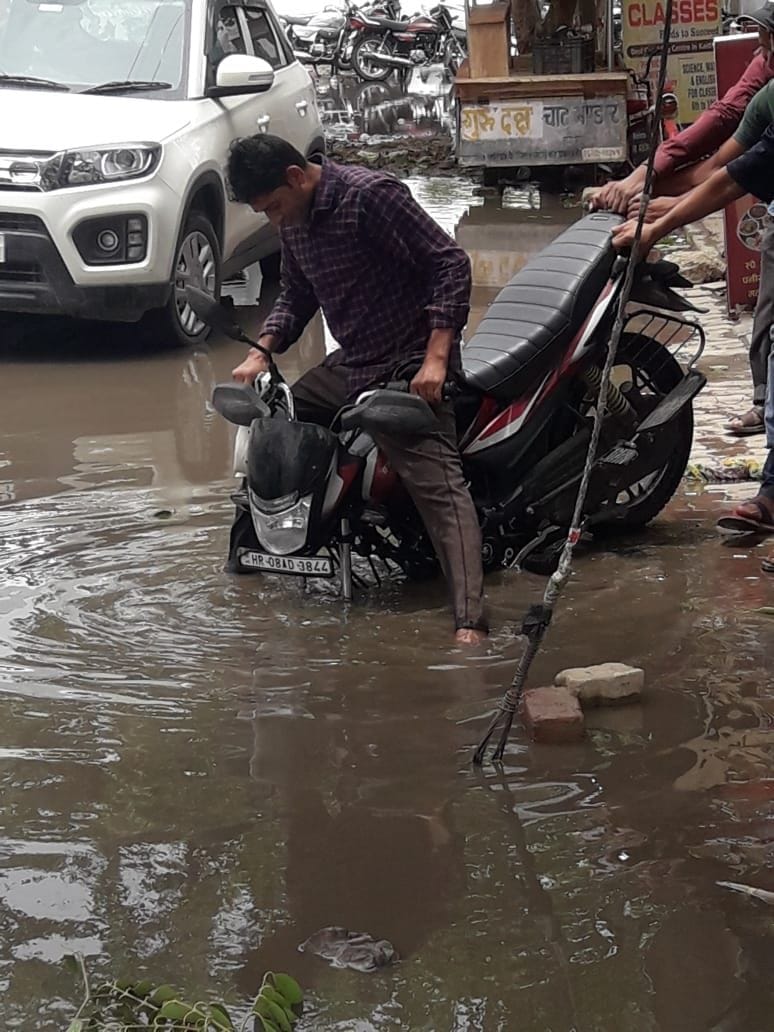 Mercury dropped due to rain, storm uprooted trees and poles