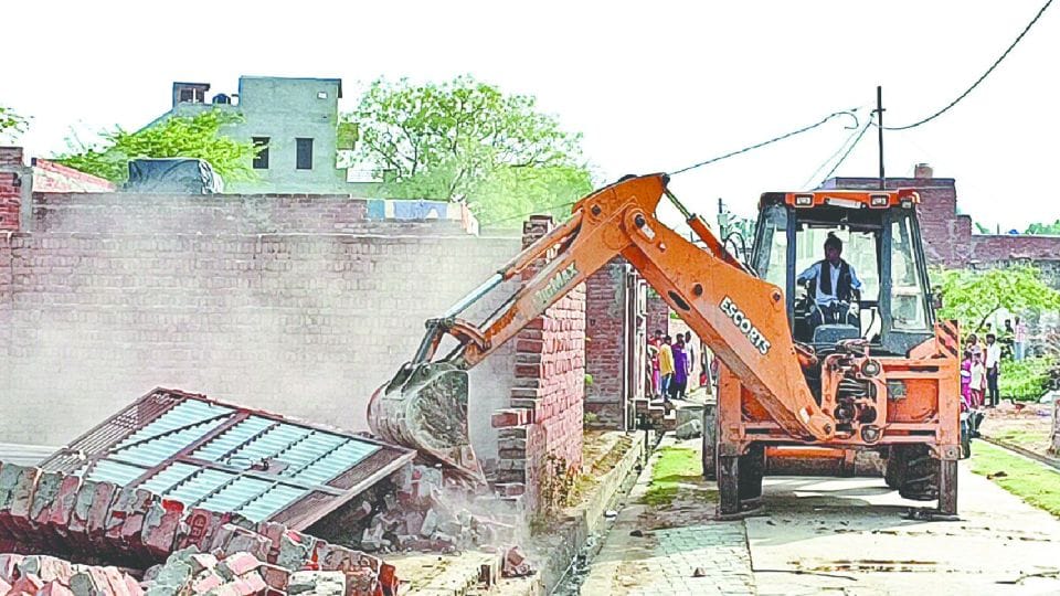 Police administration freed government land encroachment demolished by bulldozer in etah