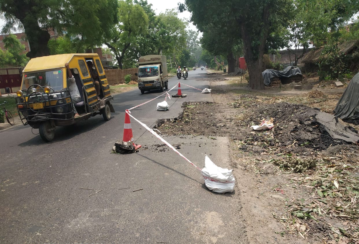 Road being built on one side, patchwork on the other side