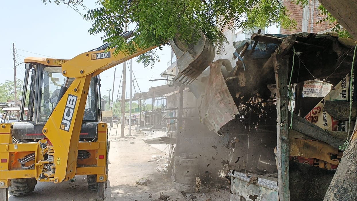Amidst the chaos, the bulldozer roared on the encroachment