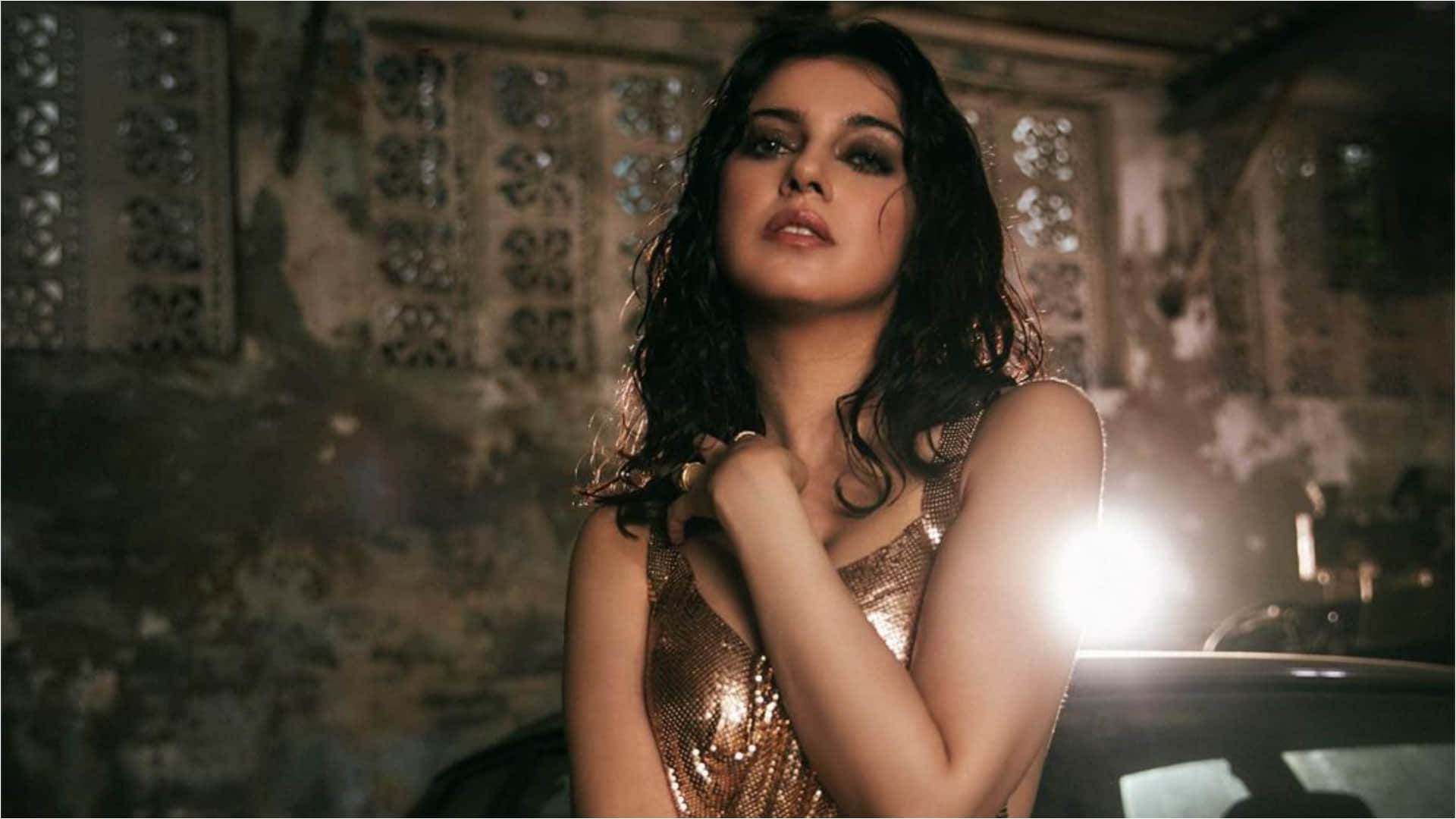 divya khosla kumar bold sultry look in golden dress for song success bash