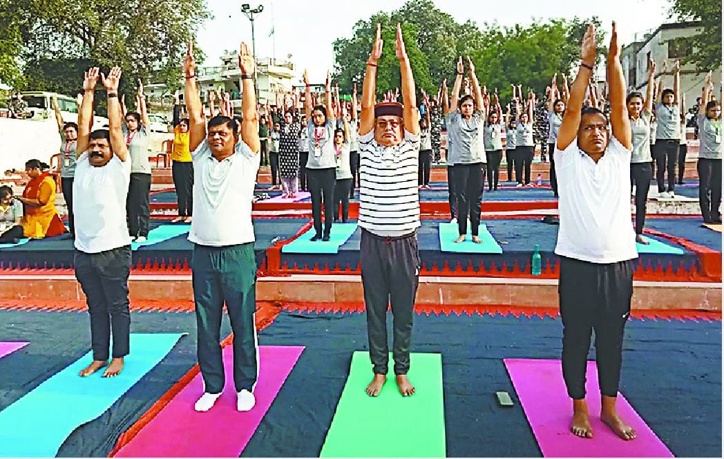 Commissioner of varanasi deepak agrawal do yoga with children amid international yaga day