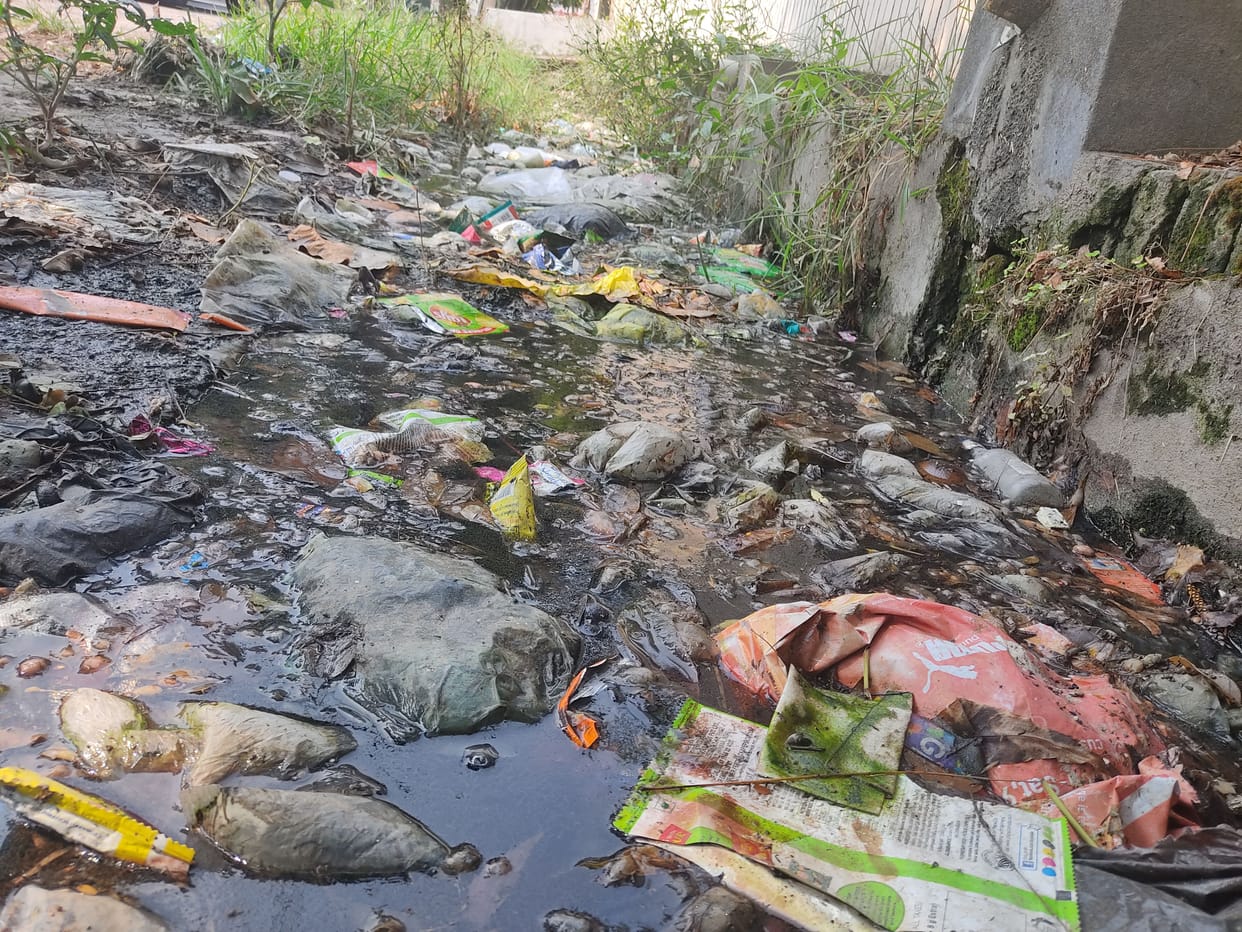 Circular road's drain clogged, water coming on the road