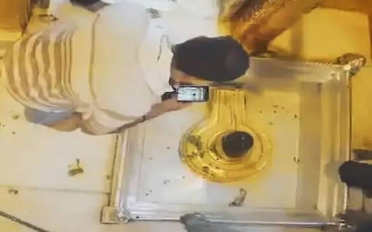 Security Laps in kashi vishwanath mandir Photo of young man taking in sanctum sanctorum goes vira