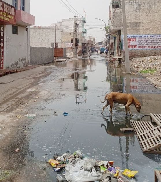 Sewer water filled on the road, people upset