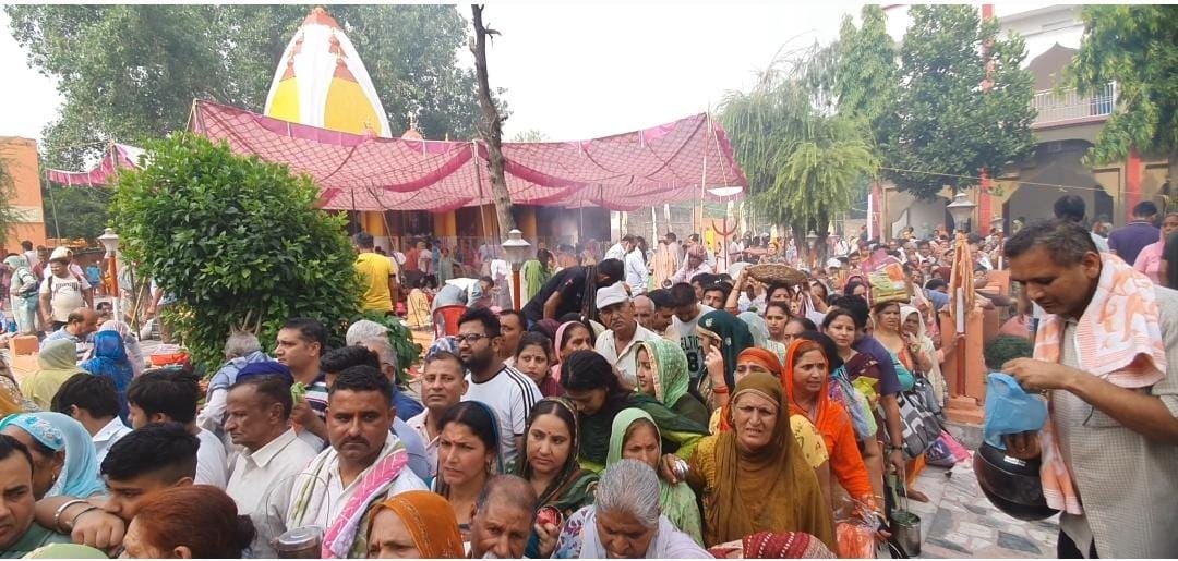 Devotees take a dip in the holy stepwell on Somvati Amavasya