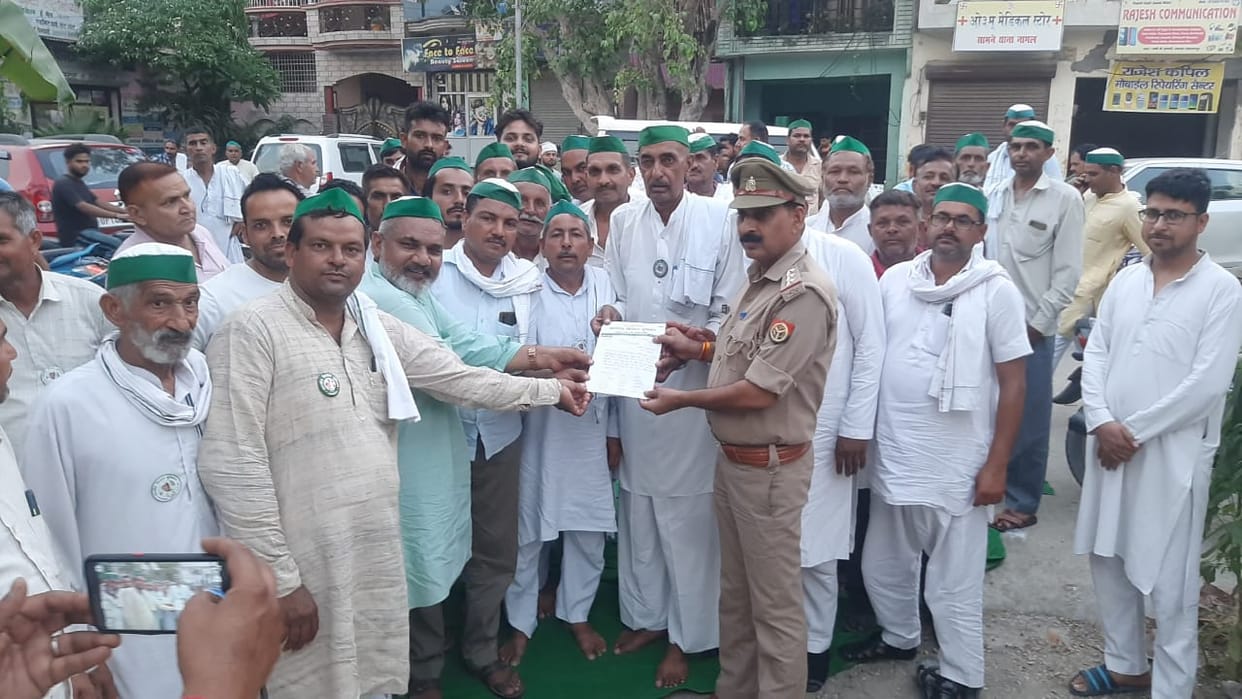 Union workers staged a sit-in at the police stations in protest against the attack on Tikait