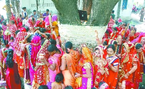 By wrapping the thread in the banyan tree, asked for the boon of being married forever.