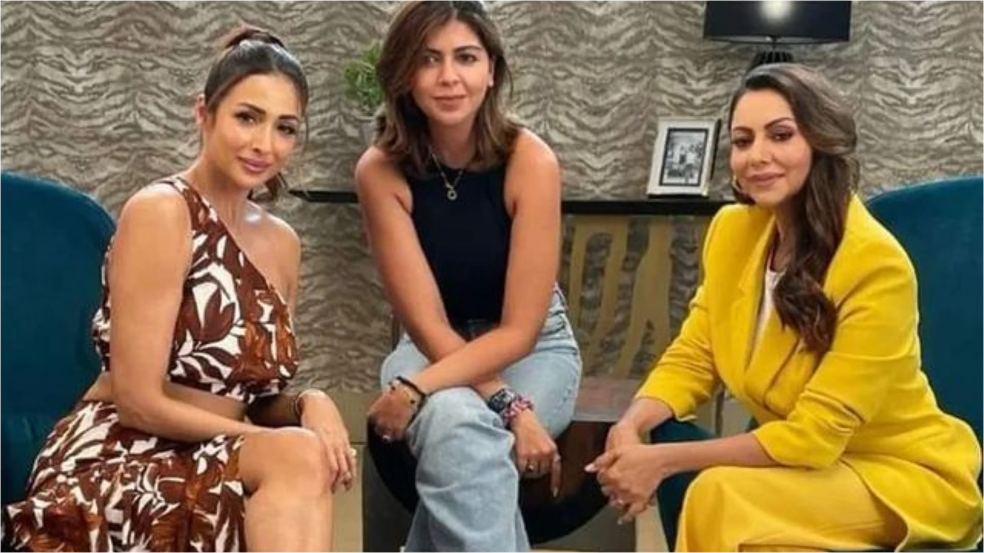 malaika arora raises temperature in brown thigh high slit one shoulder dress and printed co ord skirt set