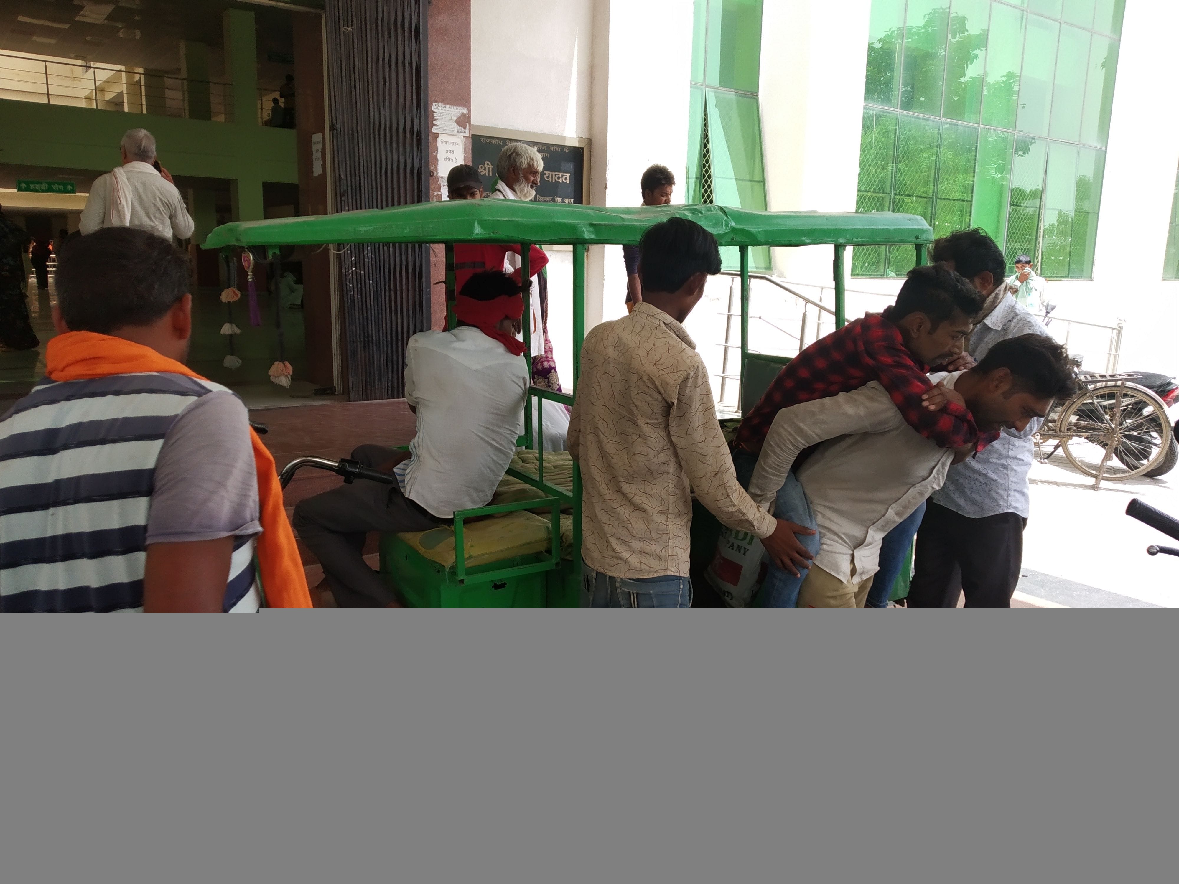 The attendants take the patients on their lap or back.