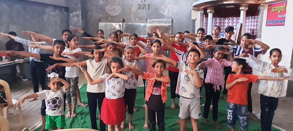 children learning to dance in summer cap