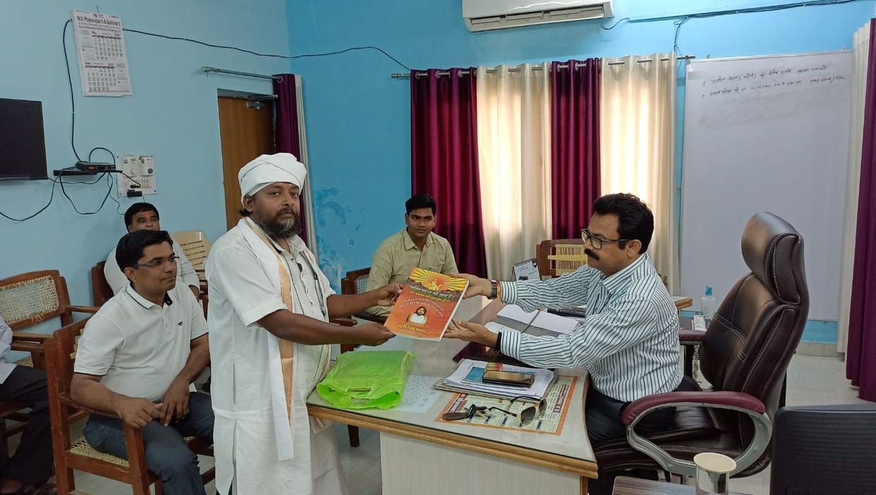 ADM returned the book to the monk
