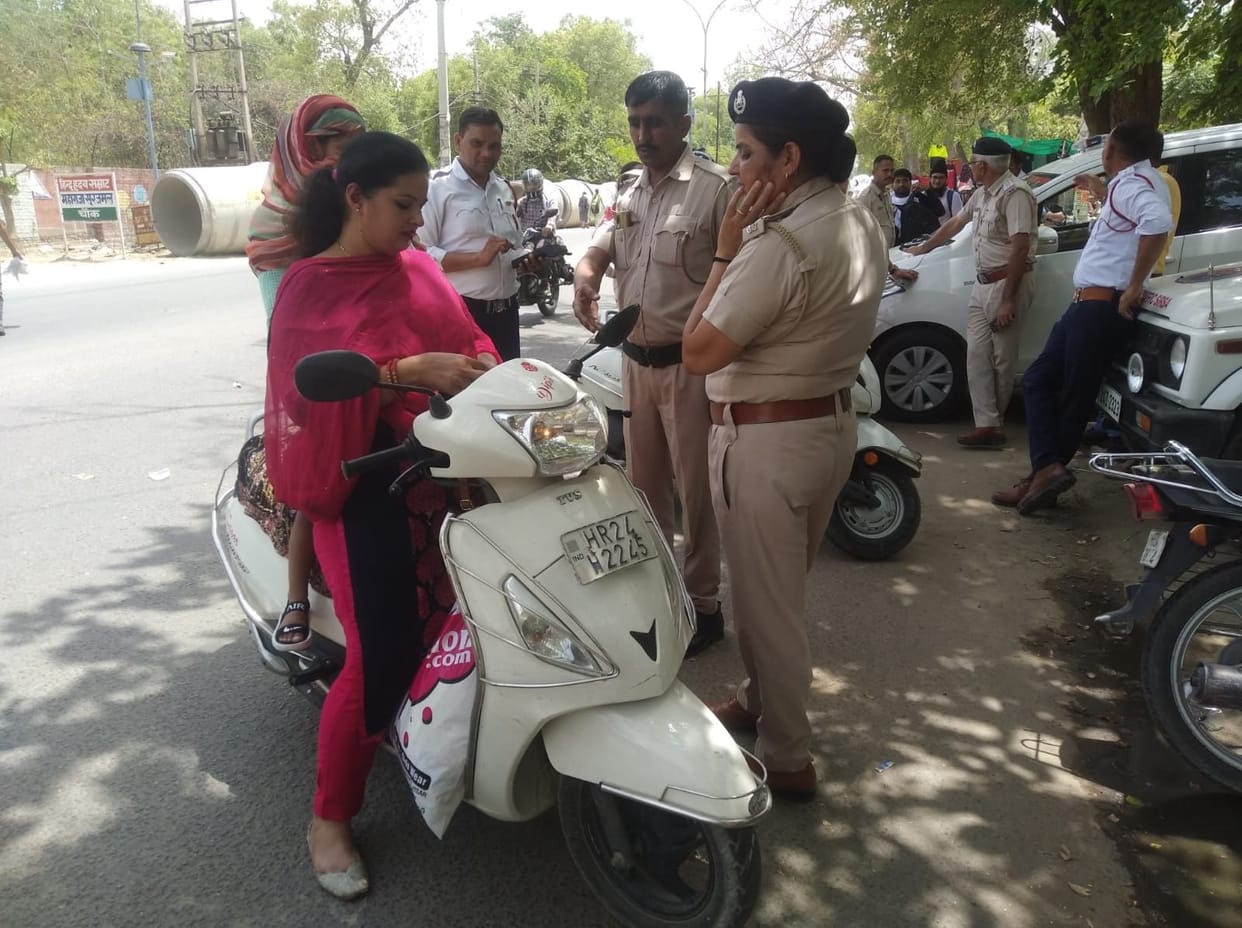 Helmet not worn, scarf tied then challan had to be cut