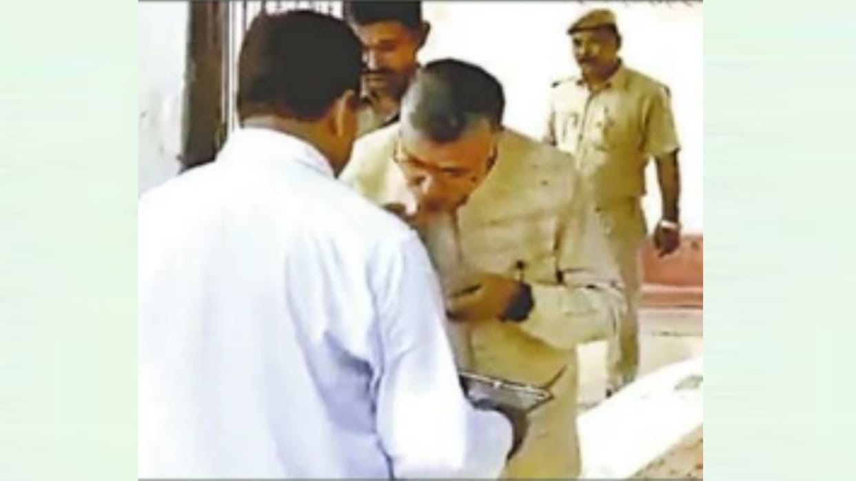 UP minister have food in jail with prisoners.