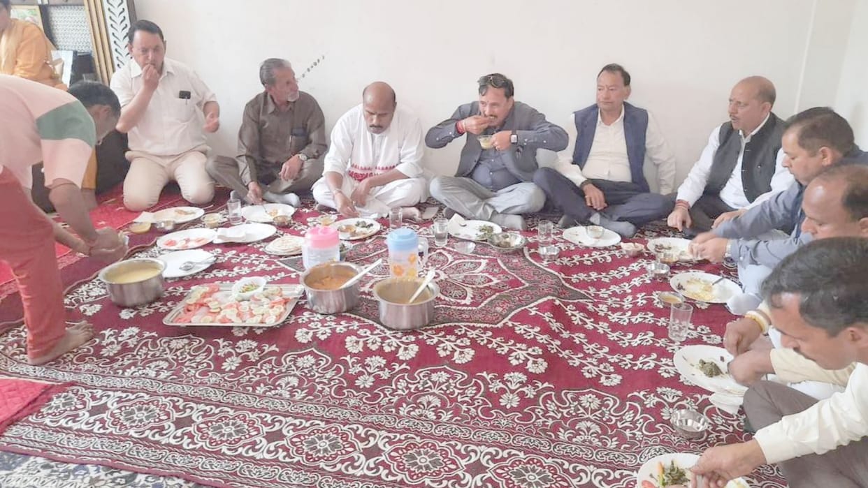 union minister dr virender kumar has meal at poor family home in chamba himachal pradesh