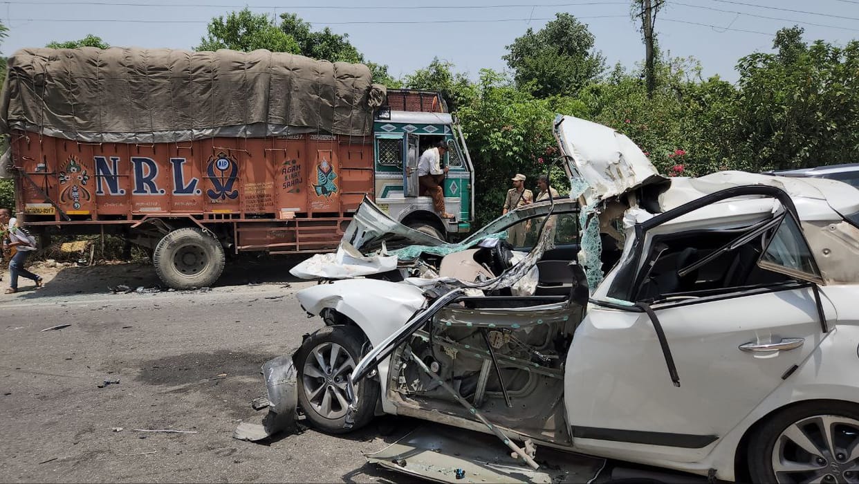 Car collided with parked truck, two youths injured