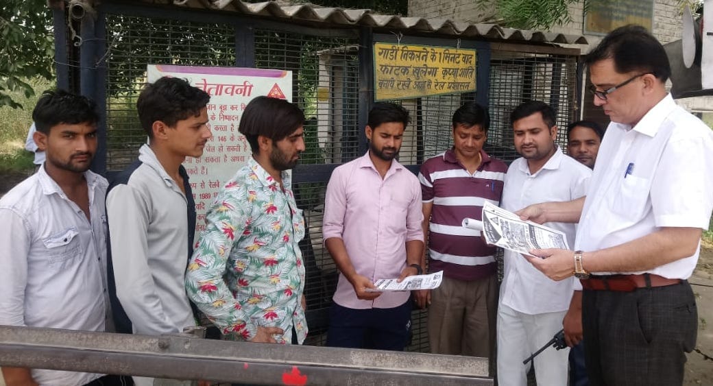 Distributed leaflets at railway gates, made passengers aware