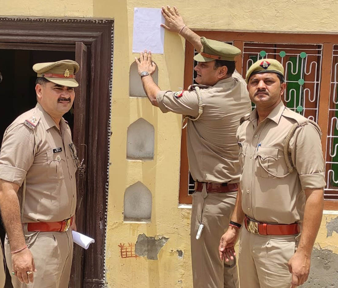 Attachment notice pasted at the house of absconding accused
