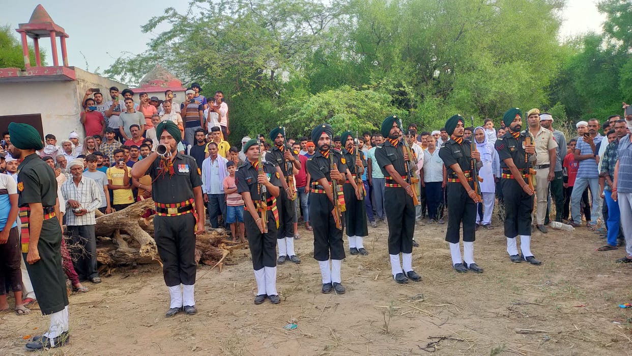 Villagers and army personnel bid farewell to Lal of the district with moist eyes