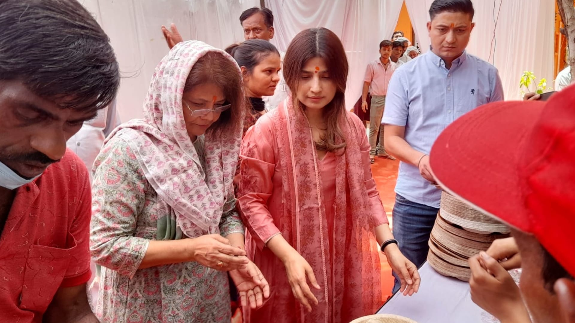 Dimple yadav distribute food on bada mangal.