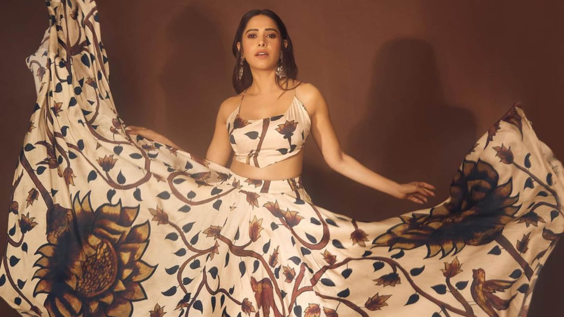 nushrat bharucha backless blouse with printed lehenga looks elegant