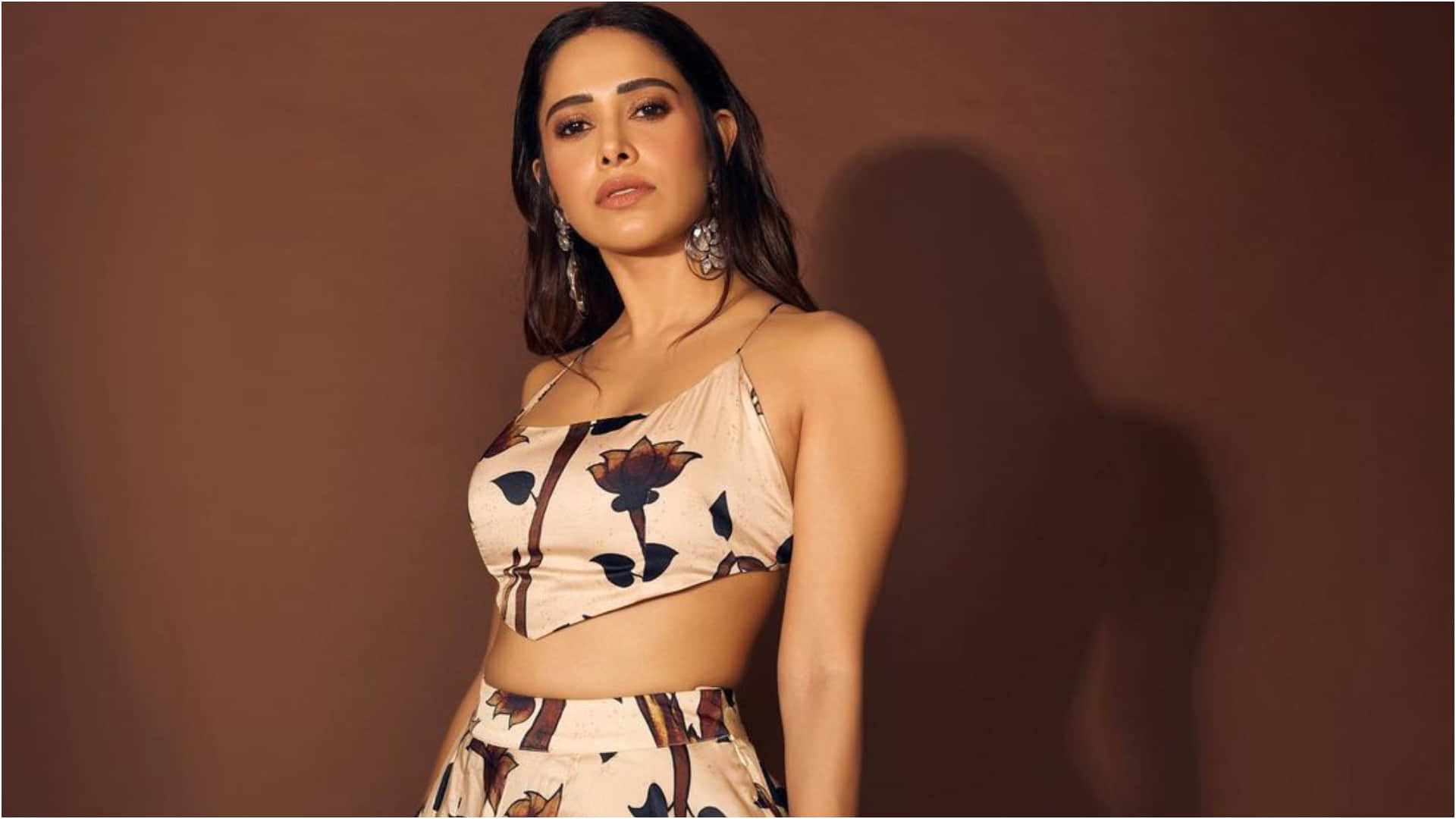 nushrat bharucha backless blouse with printed lehenga looks elegant