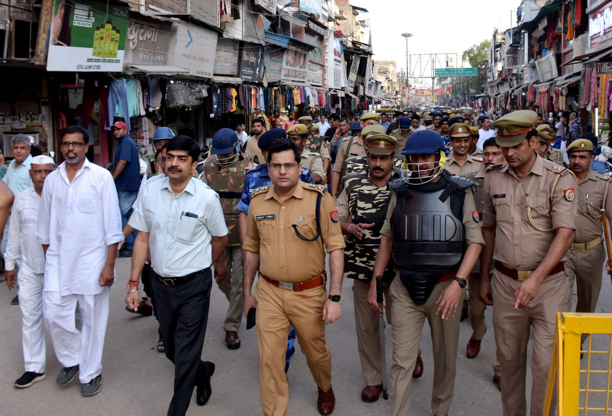 Assured of security by taking out flag march