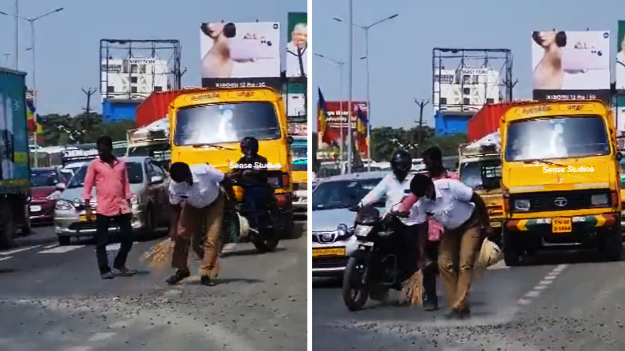 traffic policeman sweeping pebbles off busy road video viral wins hearts