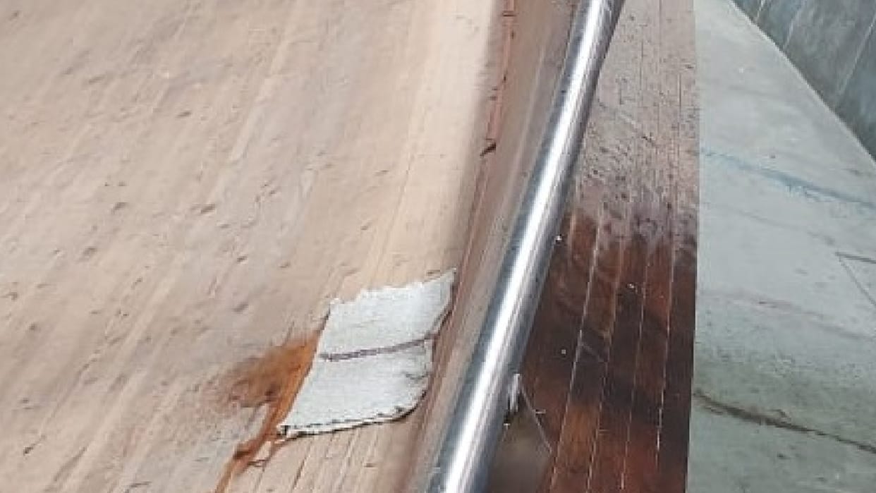 Asian Track Cycling Championships roof of velodrome leaks due to rain Japanese riders clean the track before practice