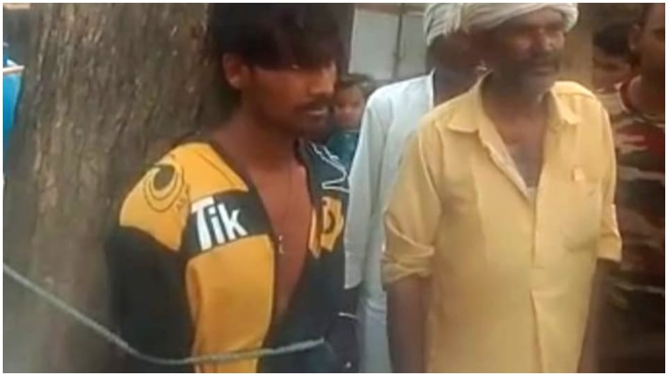 Villagers beat young man by tying him to tree Ajmer Rajasthan
