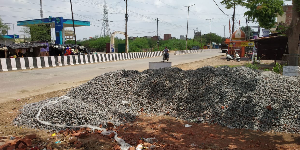 Encroachment removed on papers, sand on the pavement, heaps of moorang