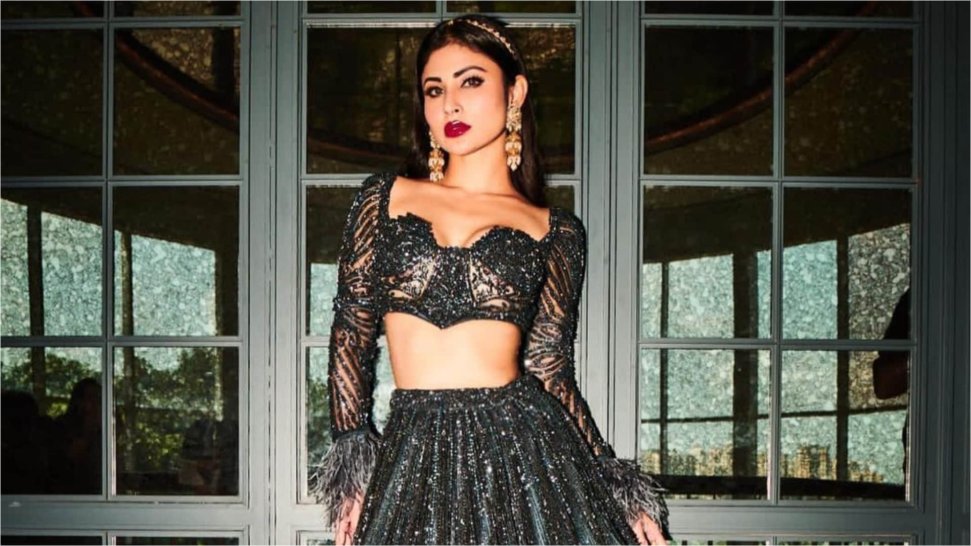 mouni roy glitter in black lehenga and full sleeve blouse with fur detailing for magazine photoshoot